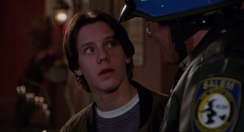 Movie still from “Hocus Pocus” (1993), directed by Kenny Ortega – A young man is being examined by an older man; Close Up shot, Over the shoulder angle