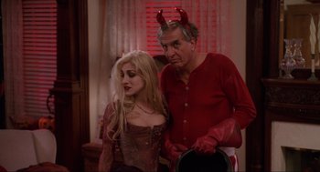 Movie still from “Hocus Pocus” (1993), directed by Kenny Ortega – A man and a woman dressed up as a devil; Medium shot, High angle