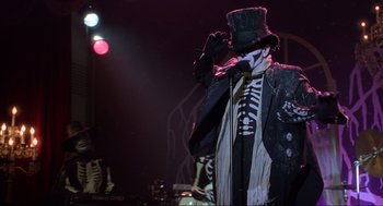 Movie still from “Hocus Pocus” (1993), directed by Kenny Ortega – A person in a costume on a stage; Medium shot, Low angle