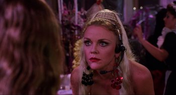 Movie still from “Hocus Pocus” (1993), directed by Kenny Ortega – A woman wearing a headpiece looking into a mirror; Close Up shot, Over the shoulder angle