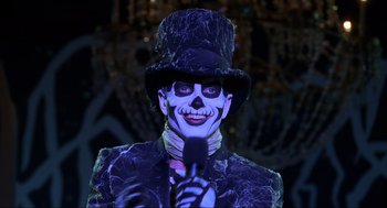 Movie still from “Hocus Pocus” (1993), directed by Kenny Ortega – A man with a skeleton face makeup and a top hat; Close Up shot, Over the shoulder angle
