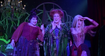 Movie still from “Hocus Pocus” (1993), directed by Kenny Ortega – A group of people dressed as hocus pocus; Medium shot, Low angle
