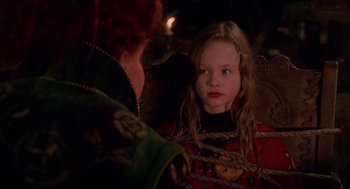 Movie still from “Hocus Pocus” (1993), directed by Kenny Ortega – A young girl in a red sweater looking at a woman in a green dress; Close Up shot, Over the shoulder angle