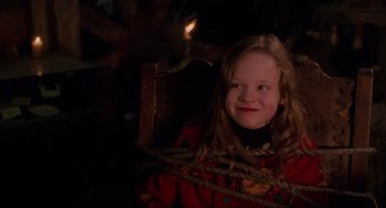 Movie still from “Hocus Pocus” (1993), directed by Kenny Ortega – A little girl sitting in a chair with a rope around her neck; Close Up shot, Over the shoulder angle