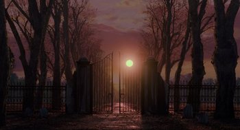 Movie still from “Hocus Pocus” (1993), directed by Kenny Ortega – An image of a gate leading to a cemetery at sunset; Extreme Wide shot, Low angle