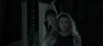 Movie still from “Hocus Pocus 2” (2022), directed by Anne Fletcher – Two young children dressed up as a witch; Close Up shot, High angle