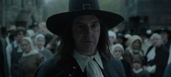 Movie still from “Hocus Pocus 2” (2022), directed by Anne Fletcher – A person wearing a hat with a crowd in the background; Close Up shot, Over the shoulder angle