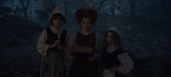 Movie still from “Hocus Pocus 2” (2022), directed by Anne Fletcher – A group of three girls standing next to each other; Medium shot, Low angle