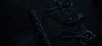 Movie still from “Hocus Pocus 2” (2022), directed by Anne Fletcher – A person holding a book in their hand; Extreme Close Up shot, Overhead angle