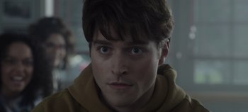 Movie still from “Hocus Pocus 2” (2022), directed by Anne Fletcher – A person wearing a hooded sweatshirt; Close Up shot, Low angle