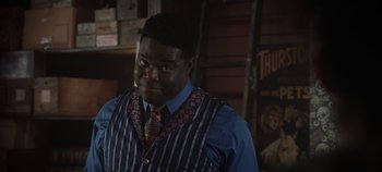 Movie still from “Hocus Pocus 2” (2022), directed by Anne Fletcher – A man in a striped vest and a tie; Close Up shot, Over the shoulder angle