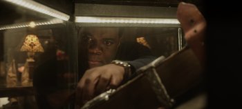 Movie still from “Hocus Pocus 2” (2022), directed by Anne Fletcher – A man looking out of a window at night; Close Up shot, Over the shoulder angle