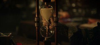Movie still from “Hocus Pocus 2” (2022), directed by Anne Fletcher – An hourglass is being held by a person; Extreme Close Up shot, High angle
