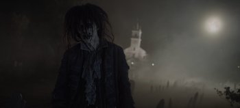 Movie still from “Hocus Pocus 2” (2022), directed by Anne Fletcher – A person in a costume standing in front of a building; Medium shot, High angle