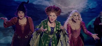 Movie still from “Hocus Pocus 2” (2022), directed by Anne Fletcher – A group of people dressed up in costumes; Medium shot, High angle