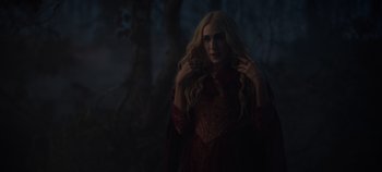 Movie still from “Hocus Pocus 2” (2022), directed by Anne Fletcher – A woman with long blonde hair wearing a red dress; Medium shot, Over the shoulder angle