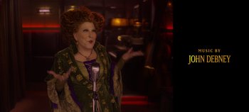 Movie still from “Hocus Pocus 2” (2022), directed by Anne Fletcher – Bette midler as winifred sanderson from hocus pocus; Medium shot, Over the shoulder angle