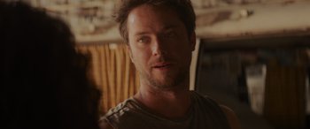 Movie still from “Holiday Harmony” (2022), directed by Shaun Paul Piccinino – A person with a beard; Close Up shot, Over the shoulder angle