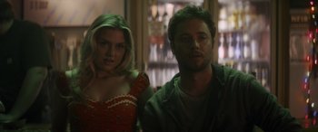 Movie still from “Holiday Harmony” (2022), directed by Shaun Paul Piccinino – A man and a woman standing next to each other; Close Up shot, Over the shoulder angle