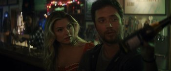 Movie still from “Holiday Harmony” (2022), directed by Shaun Paul Piccinino – A man and a woman standing next to each other; Close Up shot, Over the shoulder angle