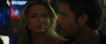 Movie still from “Holiday Harmony” (2022), directed by Shaun Paul Piccinino – A man and a woman looking at one another; Close Up shot, Over the shoulder angle