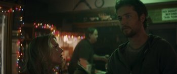 Movie still from “Holiday Harmony” (2022), directed by Shaun Paul Piccinino – A man and a woman sitting at a table; Close Up shot, Over the shoulder angle