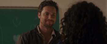 Movie still from “Holiday Harmony” (2022), directed by Shaun Paul Piccinino – A person talking to another person; Close Up shot, Over the shoulder angle