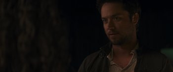 Movie still from “Holiday Harmony” (2022), directed by Shaun Paul Piccinino – A person wearing a jacket; Close Up shot, Over the shoulder angle