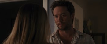 Movie still from “Holiday Harmony” (2022), directed by Shaun Paul Piccinino – A person talking to another person; Close Up shot, Over the shoulder angle