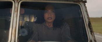Movie still from “Holiday Harmony” (2022), directed by Shaun Paul Piccinino – A woman is looking out of a car window; Close Up shot, Low angle