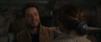 Movie still from “Holiday Harmony” (2022), directed by Shaun Paul Piccinino – A man and a woman are talking to each other; Close Up shot, Over the shoulder angle