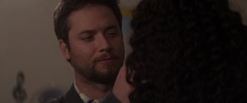 Movie still from “Holiday Harmony” (2022), directed by Shaun Paul Piccinino – A person looking at another person; Close Up shot, Over the shoulder angle