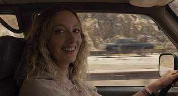 Movie still from “Hollywood Stargirl” (2022), directed by Julia Hart – A woman sitting in the driver's seat of a car; Close Up shot, Over the shoulder angle