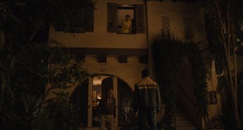 Movie still from “Hollywood Stargirl” (2022), directed by Julia Hart – Two men standing in front of a building at night looking out the window; Wide shot, Low angle