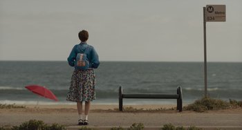 Movie still from “Hollywood Stargirl” (2022), directed by Julia Hart – A woman standing on the beach looking out at the ocean; Wide shot, Low angle