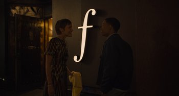 Movie still from “Hollywood Stargirl” (2022), directed by Julia Hart – A man and a woman standing in front of a sign; Medium shot, Over the shoulder angle