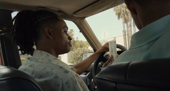 Movie still from “Hollywood Stargirl” (2022), directed by Julia Hart – A man sitting in the driver's seat of a car; Close Up shot, Over the shoulder angle