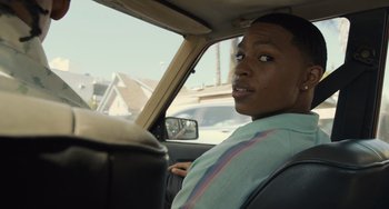 Movie still from “Hollywood Stargirl” (2022), directed by Julia Hart – A man sitting in the driver's seat of a car; Close Up shot, Over the shoulder angle