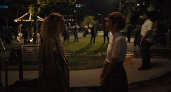 Movie still from “Hollywood Stargirl” (2022), directed by Julia Hart – Two women standing next to each other on a sidewalk; Medium shot, Over the shoulder angle