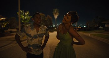 Movie still from “Hollywood Stargirl” (2022), directed by Julia Hart – A man and a woman standing next to each other; Medium shot, High angle