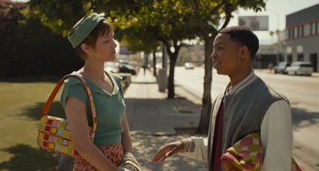 Movie still from “Hollywood Stargirl” (2022), directed by Julia Hart – A woman and a man talking on the sidewalk; Medium shot, Over the shoulder angle