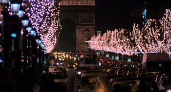 Movie still from “Home Alone” (1990), directed by Chris Columbus – A street filled with lots of traffic at night time; Extreme Wide shot, High angle