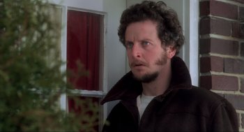 Movie still from “Home Alone” (1990), directed by Chris Columbus – A person with a beard; Close Up shot, Low angle