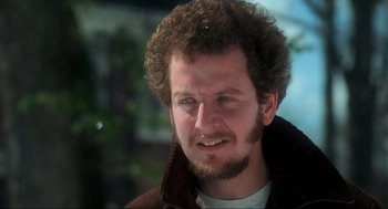 Movie still from “Home Alone” (1990), directed by Chris Columbus – A person with a beard; Close Up shot, High angle