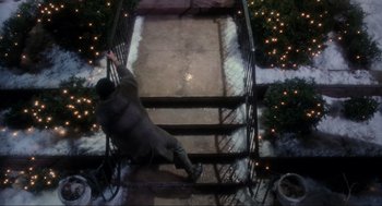 Movie still from “Home Alone” (1990), directed by Chris Columbus – A man falling down a flight of stairs in the snow; Wide shot, Overhead angle