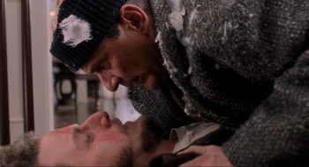 Movie still from “Home Alone” (1990), directed by Chris Columbus – Two men in the middle of a fight; Close Up shot, Overhead angle