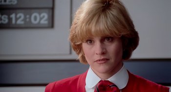 Movie still from “Home Alone 2: Lost in New York” (1992), directed by Chris Columbus – A person wearing a suit and tie; Close Up shot, Low angle