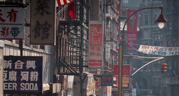 Movie still from “Home Alone 2: Lost in New York” (1992), directed by Chris Columbus – A street scene with various signs and buildings; Extreme Wide shot, High angle