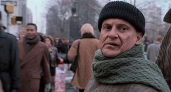 Movie still from “Home Alone 2: Lost in New York” (1992), directed by Chris Columbus – A person wearing a hat and a scarf; Close Up shot, Low angle