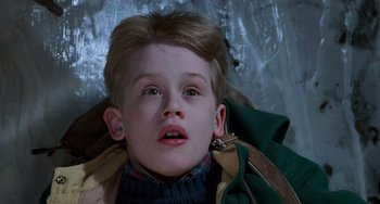 Movie still from “Home Alone 2: Lost in New York” (1992), directed by Chris Columbus – A child laying on the ground; Close Up shot, Low angle